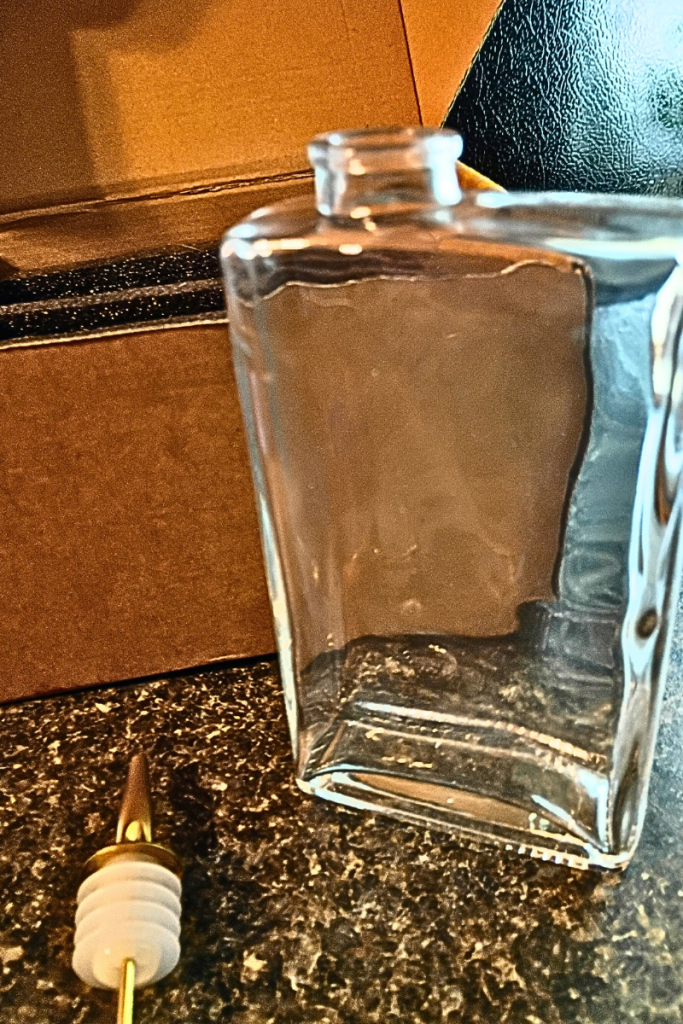 Bottle in front of box