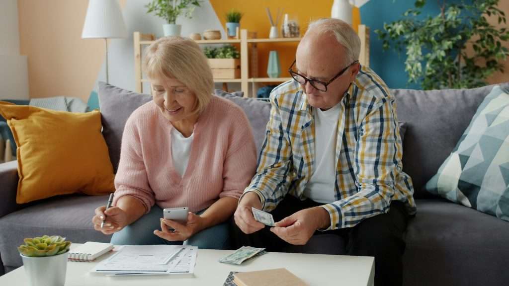 Older couple paying bills