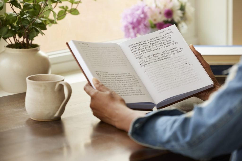 Woman holding the Tracing Edition Bible