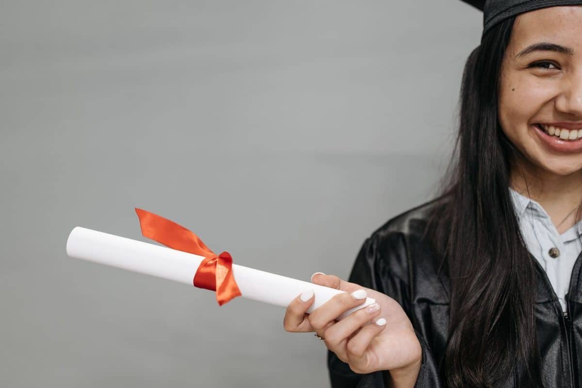 Graduate with diploma